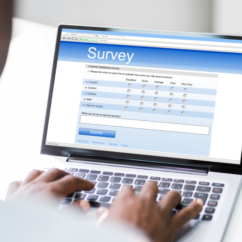 Forms, feedback and tracking shown through a digital customer satisfaction survey on a laptop, capturing ratings and written responses