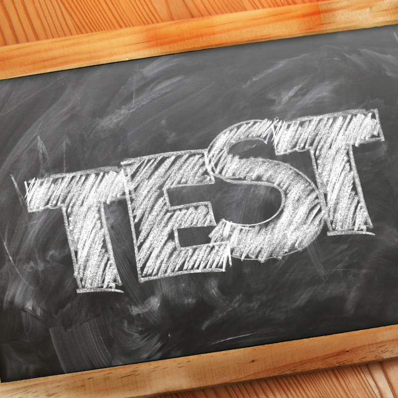 A/B Testing concept shown with the word “TEST” written in bold chalk letters on a blackboard.